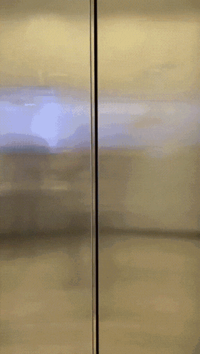 a stainless steel refrigerator door has a sticker on it that says do not open