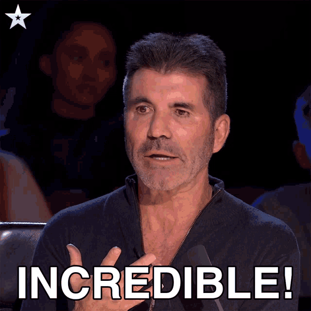 a man sitting in front of a microphone with the word incredible written below him