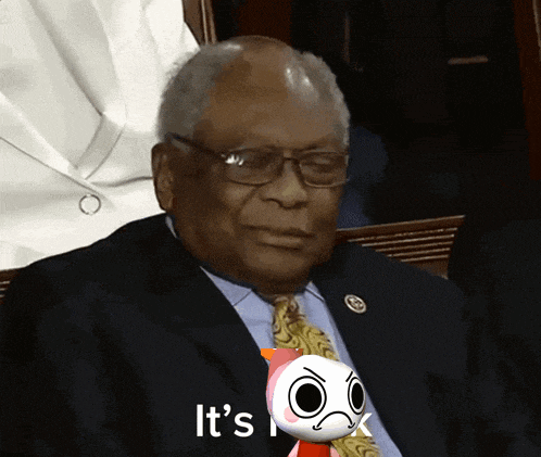 a man in a suit and tie is holding a stuffed animal that says " it 's "