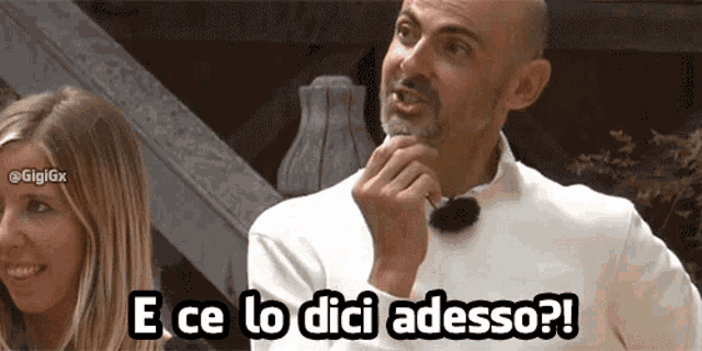 a man and a woman are standing next to each other and the man says e ce lo dice adesso