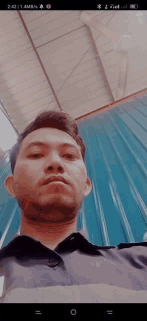 a man is taking a picture of himself on his phone