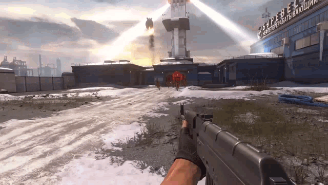 a person is holding a gun in front of a building that says ' sputnik '
