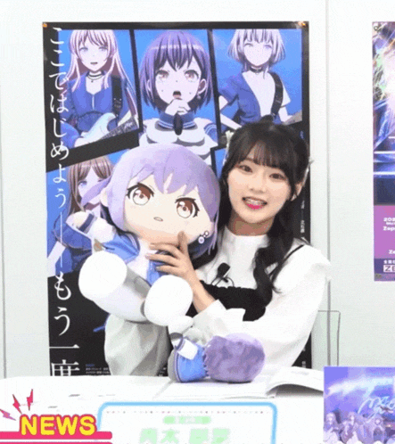 a girl holding a stuffed animal in front of a poster that says ' news ' on it