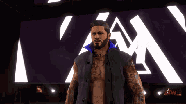 a man with a beard and tattoos is standing in front of a purple and white sign that says i am
