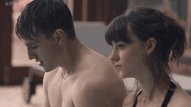a man and a woman are standing next to each other with npgifs written on the bottom of the image