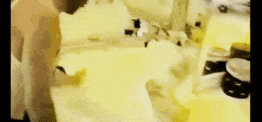 a woman is taking a bath in a tub filled with foam .