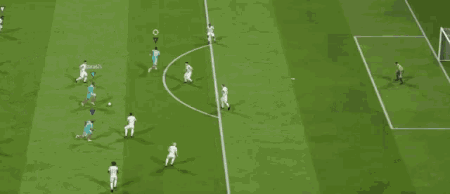 a soccer game is being played on a field with a yellow circle in the middle of the field
