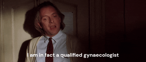 a man in a white shirt and red tie says i am in fact a qualified gynaecologist