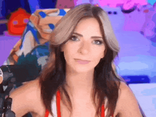 a woman is sitting in a chair with a microphone in front of her .