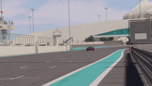 a red sports car is driving down a road