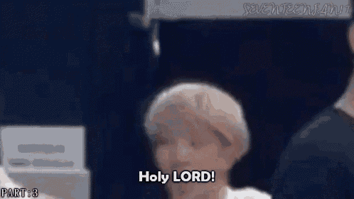 a close up of a person 's face with the words `` holy lord '' .