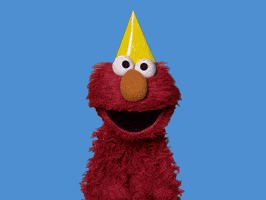 elmo from sesame street stands in front of a blue background