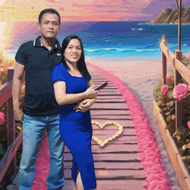 a man and a woman are posing for a picture on a wooden walkway