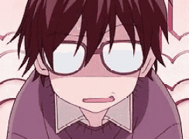 a close up of a boy wearing glasses and a purple sweater .