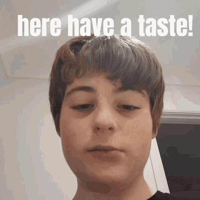 a young boy with the words here have a taste