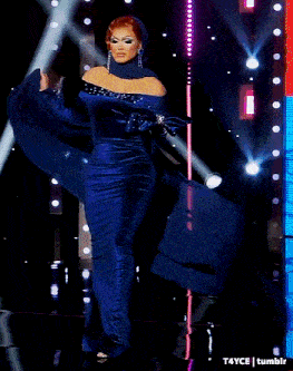a woman in a blue dress is standing on a stage with a t4yce tumblr watermark