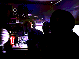 a blurry picture of a man with a target on the wall