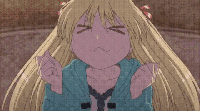 a girl with long blonde hair is making a face with her eyes closed