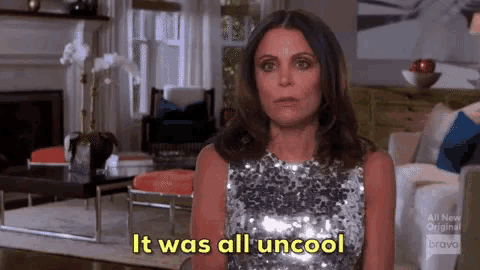 a woman in a sequined dress is standing in a living room and says it was all uncool .