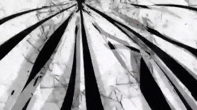 a black and white image of a broken glass with a circular pattern on it .