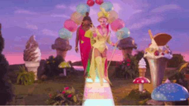 a couple of women are walking down a rainbow surrounded by ice cream cones .