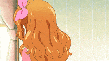 a cartoon girl with long orange hair and a pink bow