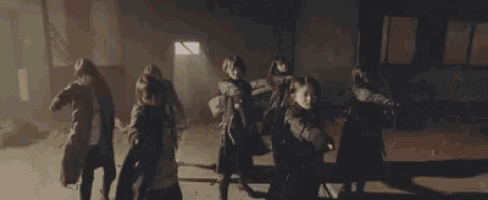 a group of people are fighting each other on a stage .