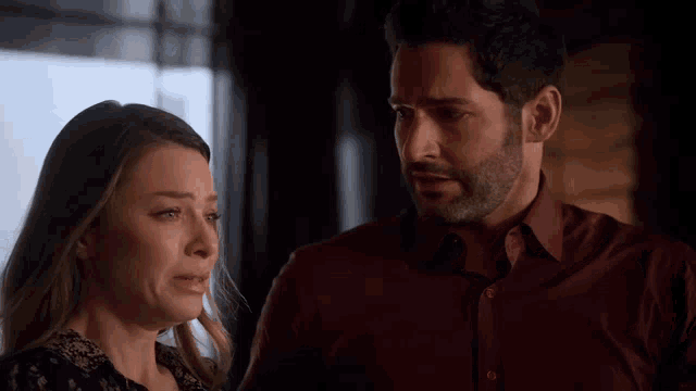 a man and a woman are standing next to each other