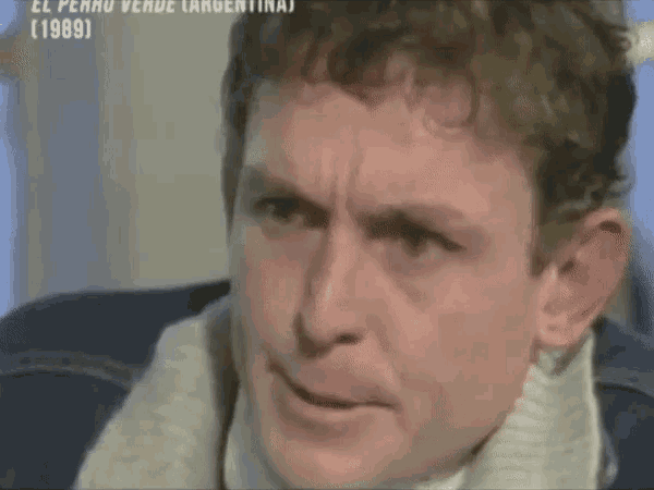 a close up of a man 's face with the year 1989 visible