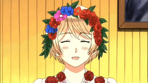 a girl wearing a wreath of flowers on her head is smiling