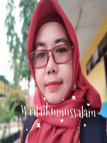 a woman wearing glasses and a red scarf with the words waalaikummussalamu written on it