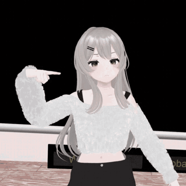 a girl in a white sweater is pointing her finger