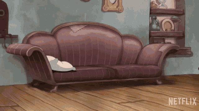 a couch in a room with a netflix logo on the bottom