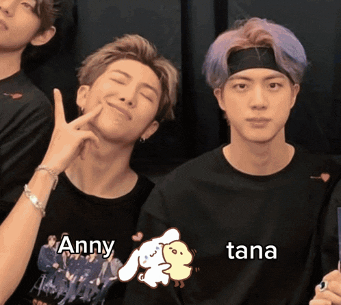 a group of young men are posing for a picture and one of them has the name tana written on his shirt