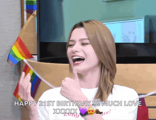 a woman with a rainbow flag in the background says happy 21st birthday much love