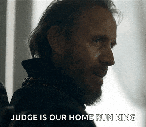 a man with a beard and the words judge is our home run king on the bottom