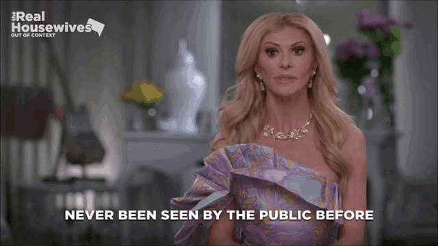 a woman in a purple dress with the words never been seen by the public before below her