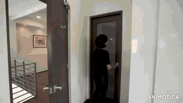 a man is opening a door in a hallway made in animotica