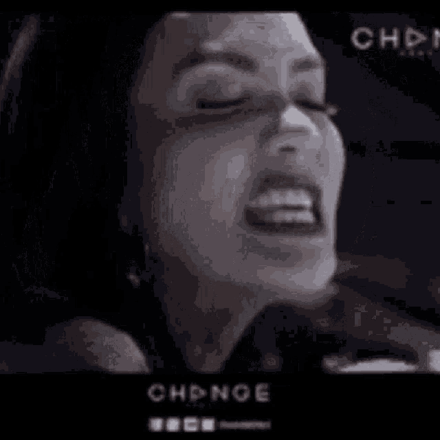 a close up of a woman 's face with the word change on the bottom right