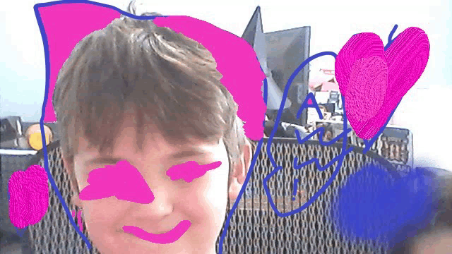 a drawing of a boy 's face with pink and blue hearts