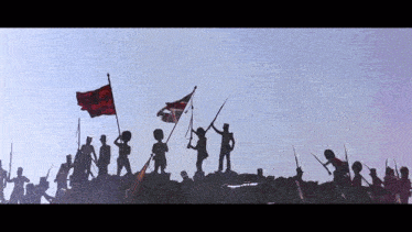 a group of soldiers standing on top of a hill holding flags and guns