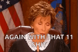 a judge is sitting in front of an american flag and says `` again with that 11 shit ''