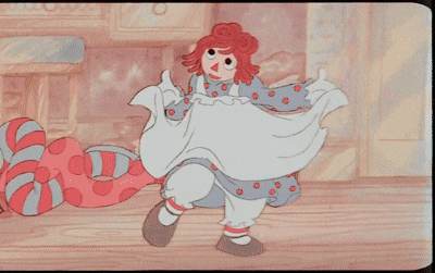 a cartoon of a doll with red hair and polka dots on her dress