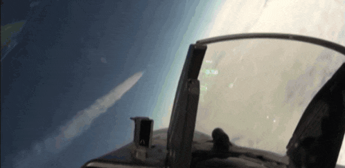 a cockpit view of a fighter jet flying over the earth with a screen that says ' altitude ' on it