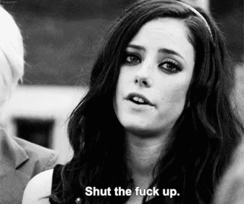 a black and white photo of a woman talking to a man and saying `` shut the fuck up '' .