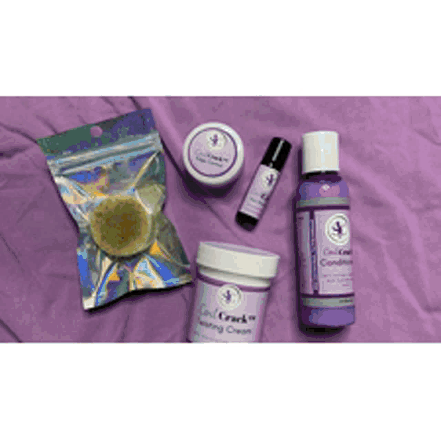 a bottle of cool crack conditioning cream is sitting on a purple cloth