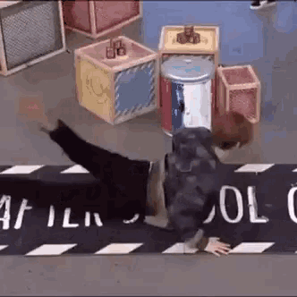 a person is doing a handstand on a sign that says ' a film ' on it