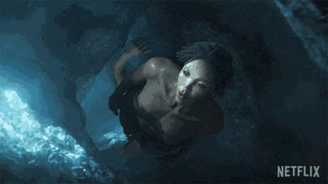 a netflix ad shows a man swimming in the water