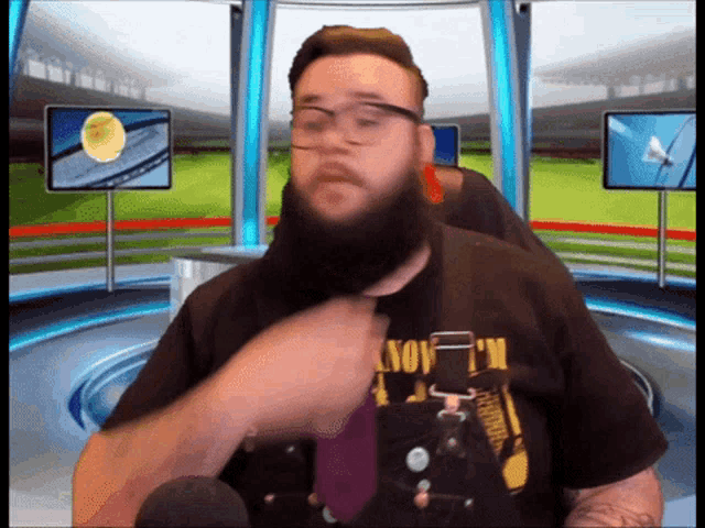 a man with a beard is wearing a shirt that says " know i 'm " on it
