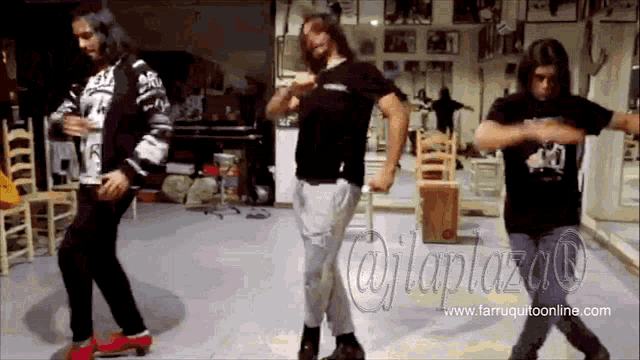 three men are dancing in a room with the website www.farruquitoonline.com visible
